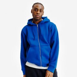 Bluza na suwak unisex Elementals. Niebieskie bluzy DECATHLON, uniwersalny, bez wzorów, z bawełny, z kapturem. Za 199.99 zł.