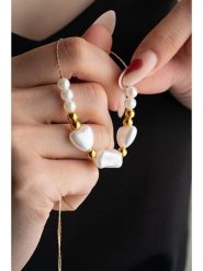 Heliophilia Naszyjnik z perłami syntetycznymi rozmiar: onesize. Żółte naszyjniki Heliophilia, z perłą, z mosiądzu. Za 26.99 zł.