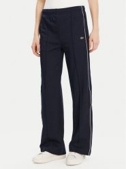 Lacoste Spodnie dresowe XF7260 Granatowy Relaxed Fit. Niebieskie spodnie dresowe Lacoste, bez wzorów, z dresówki. Za 379.99 zł.