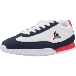 Kapcie LE COQ SPORTIF VELOCE I GS Biały. Białe obuwie domowe Le Coq Sportif, bez wzorów, z syntetyku, bez zapięcia. Za 170.99 zł.