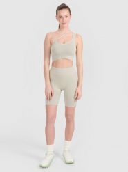 4F Legginsy kolarki bezszwowe treningowe damskie - beżowe M/L. Brązowe legginsy sportowe 4f, l, bez wzorów. W wyprzedaży za 59.99 zł.