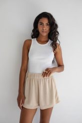 Top na ramiączkach prążkowanej dzianiny w kolorze CLASSIC WHITE - ISLA-L. Białe topy Marsala, l, bez wzorów, z bawełny, bez kołnierzyka, bez ramiączek. Za 119.90 zł.