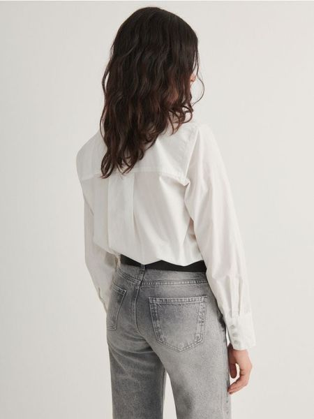 Bawełniana koszula - biały. Białe koszule Reserved, l, bez wzorów, z bawełny, bez kołnierzyka, bez ramiączek. Za 109.99 zł.