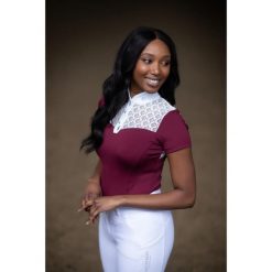 Damska koszulka do jazdy konnej Equestrian Stockholm Champion. Czerwone bluzki EQUESTRIAN STOCKHOLM, bez wzorów, sportowe, bez kołnierzyka, bez ramiączek. Za 408.50 zł.