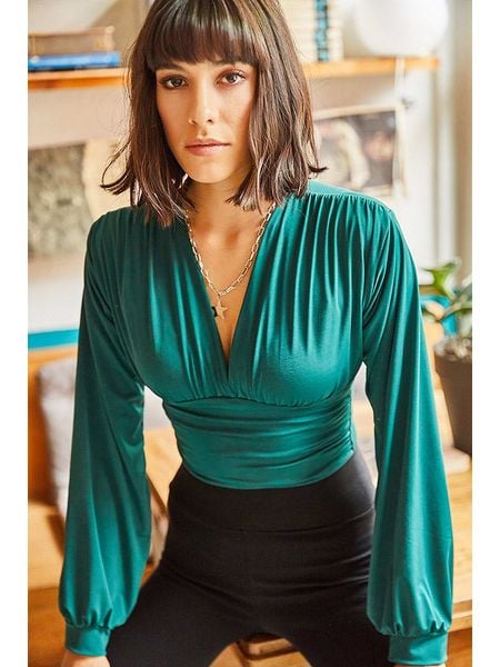 Olalook Bluzka w kolorze turkusowym rozmiar: M. Niebieskie bluzki Olalook, m, bez wzorów, bez kołnierzyka, bez ramiączek. Za 61.46 zł.