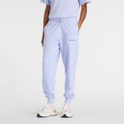 Spodnie damskie New Balance WB61D3EADYK – fioletowe. Fioletowe spodnie dresowe New Balance, m, bez wzorów, z bawełny. Za 259.99 zł.