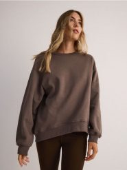 Bluza oversize - brązowy. Brązowe bluzy Reserved, l, bez wzorów, z bawełny, bez kaptura. W wyprzedaży za 49.99 zł.