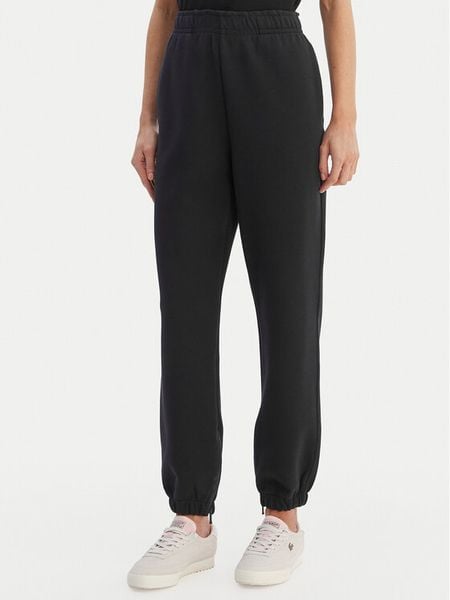 Lacoste Spodnie dresowe XF5244 Granatowy Regular Fit. Niebieskie spodnie dresowe Lacoste, bez wzorów, z dresówki. Za 609.99 zł.