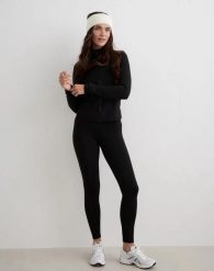 Damskie legginsy wysoki stan, drapane wewnątrz, second skin Warming czarny. Czarne legginsy AIM'N, m, bez wzorów, z elastanu, z podwyższonym stanem, do biegania. Za 349.00 zł.