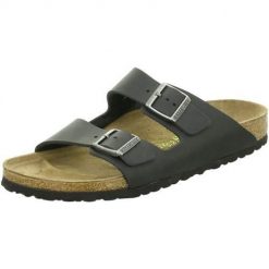Klapki Birkenstock 552113. Czarne klapki Birkenstock, bez wzorów, z materiału, bez obcasa. Za 713.00 zł.