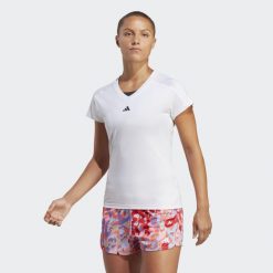 Koszulka AEROREADY Train Essentials Minimal Branding V-Neck. Białe bluzki Adidas, s, bez wzorów, z elastanu, sportowe, bez kołnierzyka, bez ramiączek. Za 109.00 zł.