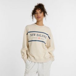 Bluza damska New Balance WT51923LIN – beżowa. Brązowe bluzy New Balance, m, z aplikacjami, z bawełny, bez kaptura. Za 249.99 zł.