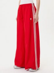 Adidas Spodnie dresowe adicolor Firebird JD3388 Czerwony Loose Fit. Czerwone spodnie dresowe Adidas, xs, bez wzorów, z dresówki. Za 399.99 zł.
