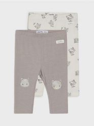 Bawełniane legginsy z motywem kotów - kremowy. Białe legginsy sportowe Sinsay, l, bez wzorów, z bawełny. W wyprzedaży za 15.99 zł.
