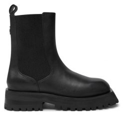 Sztyblety DKNY. Czarne botki DKNY, bez wzorów, bez obcasa, na płaskiej podeszwie, bez zapięcia. Za 1,439.00 zł.