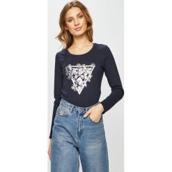 Guess Jeans - Bluzka. Niebieskie bluzki Guess Jeans, s, z aplikacjami, z bawełny, bez kołnierzyka, bez ramiączek. W wyprzedaży za 119.90 zł.