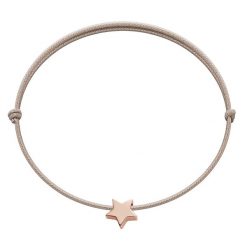 Bransoletka z gwiazdką Etincelle, różowe pozłocenie, na cienkim beżowym sznurku. Brązowe bransoletki Lilou, pozłacane. Za 79.00 zł.