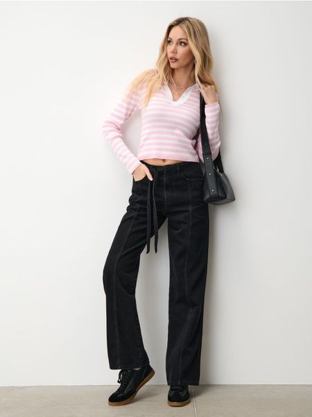 Jeansy wide leg - czarny. Czarne jeansy Sinsay, l, bez wzorów. W wyprzedaży za 33.99 zł.