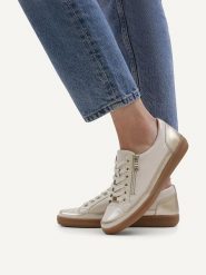 Caprice Skórzane sneakersy w kolorze kremowym rozmiar: 37,5. Brązowe trampki Caprice, bez wzorów, bez zapięcia. Za 196.70 zł.
