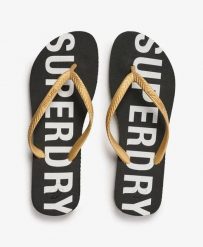 Superdry Klapki Code Essential z gumy – Czarny/Złoto metaliczne. Czarne klapki Superdry, bez wzorów, z gumy, bez obcasa. Za 104.55 zł.