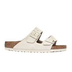 Sandały Birkenstock Arizona Antique White. Białe sandały Birkenstock, bez wzorów, ze skóry, eleganckie, bez obcasa, bez zapięcia. Za 529.90 zł.