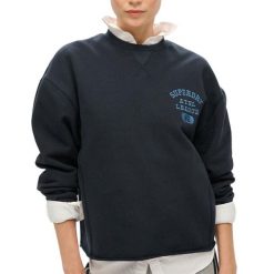 Krótka i luźna bluza damska Superdry Athletic Essentials. Niebieskie bluzy sportowe Superdry, xl, bez wzorów, z bawełny, bez kaptura. Za 316.30 zł.