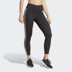 Legginsy treningowe z wysokim stanem Train Essentials 3-Stripes 7/8. Czarne legginsy Adidas, xs, bez wzorów, z materiału, z podwyższonym stanem. Za 229.00 zł.