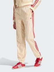 Adidas Spodnie dresowe Pinstripe Firebird Track Ptan KT1851 Kremowy Regular Fit. Białe spodnie dresowe Adidas, xs, bez wzorów, z dresówki. Za 399.99 zł.