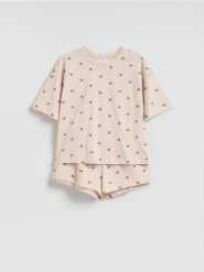 Dwuczęściowa piżama w serca - kremowy. Białe piżamy Reserved, bez wzorów, z bawełny, bez ramiączek. Za 69.99 zł.