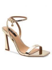 Nine West Sandały 123AL1713 Złoty. Żółte sandały Nine West, bez wzorów, ze skóry, bez obcasa, na słupku, bez zapięcia. Za 229.99 zł.