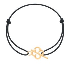 Bransoletka z pozłacanym zapięciem w kształcie koniczyny na cienkim czarnym sznurku. Czarne bransoletki Lilou, pozłacane. Za 89.00 zł.