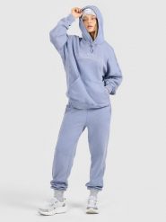 4F Spodnie dresowe joggery damskie - niebieskie XS. Niebieskie spodnie sportowe 4f, xs, bez wzorów, z dresówki. Za 149.99 zł.