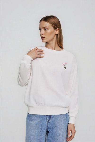 Bluza z haftowanym kwiatem biała. Białe bluzy MOODO, l, bez wzorów, z bawełny, bez kaptura. W wyprzedaży za 69.99 zł.