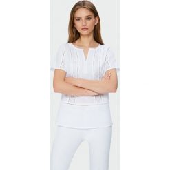 Biała bluzka z ozdobną koronką. Białe bluzki Greenpoint, bez wzorów, z bawełny, bez kołnierzyka, bez ramiączek. Za 49.99 zł.