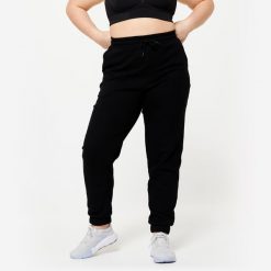Spodnie dresowe damskie Domyos Gym & Pilates. Czarne spodnie dresowe DOMYOS, s, bez wzorów, z bawełny. Za 89.99 zł.