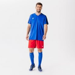 Koszulka piłkarska Kipsta Essential Club. Niebieskie bluzki KIPSTA, l, bez wzorów, z materiału, sportowe, bez kołnierzyka, bez ramiączek. Za 29.99 zł.