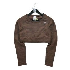 Second life - Koszulka fitnessowa dla kobiet w kolorze brązowym - Jak nowy. Brązowe bluzki Gymshark, bez wzorów, sportowe, bez kołnierzyka, bez ramiączek. Za 122.63 zł.