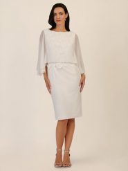 APART Sukienka w kolorze kremowym rozmiar: 36. Brązowe sukienki Apart, bez wzorów, z koronki, bez kołnierzyka, bez ramiączek, midi. Za 295.99 zł.