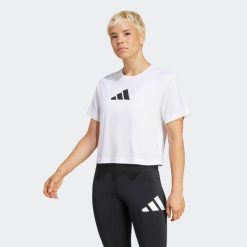 Koszulka fitness damska ADIDAS. Białe bluzki Adidas, s, bez wzorów, z materiału, sportowe, bez kołnierzyka, bez ramiączek. Za 99.99 zł.