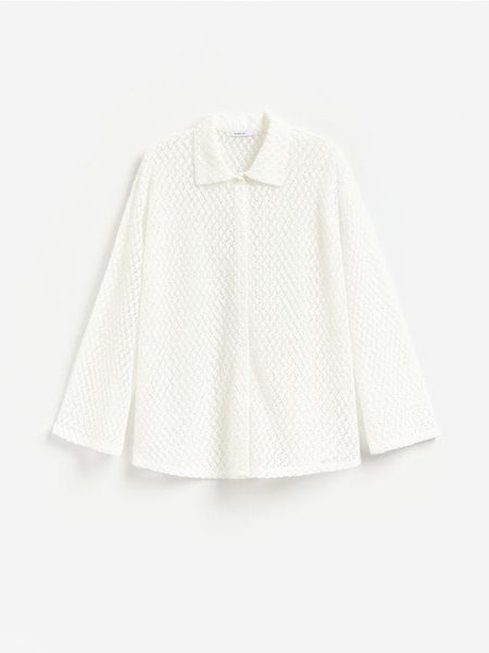 Ażurowa koszula - złamana biel. Koszule Reserved, l, w ażurowe wzory, z bawełny, bez kołnierzyka, bez ramiączek. Za 119.99 zł.