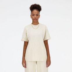 Koszulka damska New Balance WT41501LIN – beżowa. Brązowe bluzki New Balance, s, bez wzorów, z materiału, eleganckie, bez kołnierzyka, bez ramiączek. Za 169.99 zł.