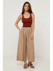 Lin Passion Lniane spodnie w kolorze karmelowym rozmiar: 36/38. Brązowe spodnie materiałowe Lin Passion, bez wzorów, ze lnu, z standardowym stanem. Za 121.99 zł.