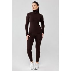 Damska bielizna termoaktywna z golfem Rough Radical Powder. Brązowa bielizna sportowa ROUGH RADICAL, bez wzorów. W wyprzedaży za 169.00 zł.