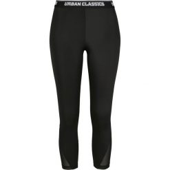 Damskie klasyczne legginsy miejskie do pedałów. Czarne legginsy Urban Classics, bez wzorów. Za 160.50 zł.