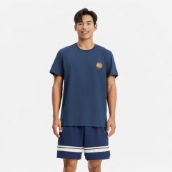 Koszulka koszykówki unisex Tarmak NBA Knicks TS 900. Niebieskie bluzki TARMAK, xl, bez wzorów, z bawełny, sportowe, bez kołnierzyka, bez ramiączek. Za 79.99 zł.