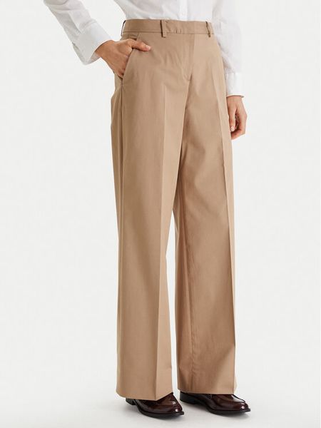 Tommy Hilfiger Spodnie materiałowe WW0WW49471 Beżowy Wide Leg. Brązowe spodnie materiałowe TOMMY HILFIGER, bez wzorów, z bawełny. Za 529.99 zł.