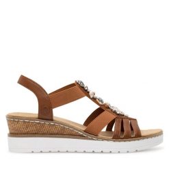 Sandały Rieker. Brązowe sandały Rieker, bez wzorów, bez obcasa, na koturnie, bez zapięcia. Za 299.99 zł.