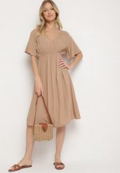 Ciemnobeżowa Bawełniana Sukienka o Rozkloszowanym Fasonie Liranelle. Brązowe sukienki Born2be, na co dzień, na lato, l, bez wzorów, z bawełny, eleganckie, bez kołnierzyka, bez ramiączek, midi, rozkloszowane. Za 49.99 zł.