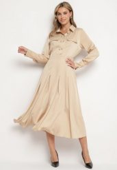 Beżowa Rozkloszowana Sukienka o Koszulowym Kroju z Imitacją Kieszeni i Gumką w Talii Rizza. Brązowe sukienki Born2be, na co dzień, l, bez wzorów, eleganckie, bez kołnierzyka, bez ramiączek, koszulowe. Za 89.99 zł.