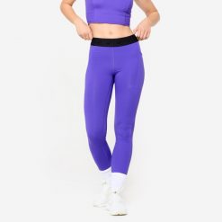 Legginsy fitness damskie Domyos. Fioletowe legginsy DOMYOS, l, bez wzorów, z elastanu. W wyprzedaży za 69.99 zł.